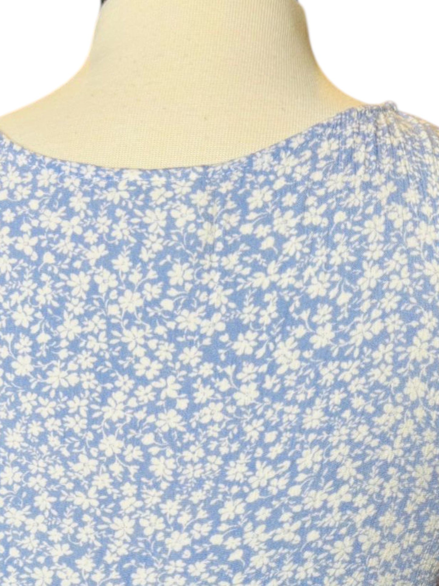 Light blue flower button top
