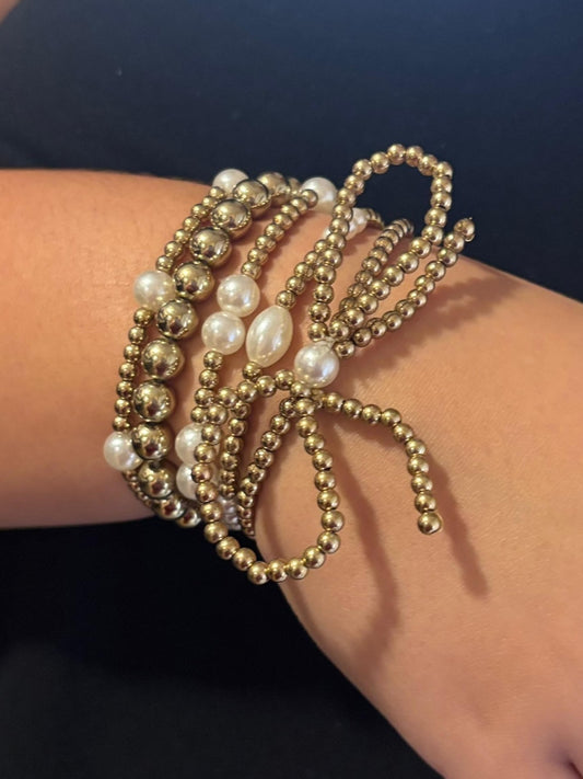 bow and pearl bracelet stack