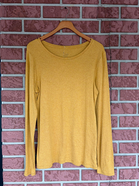 A new day mustard colored long sleeve tee