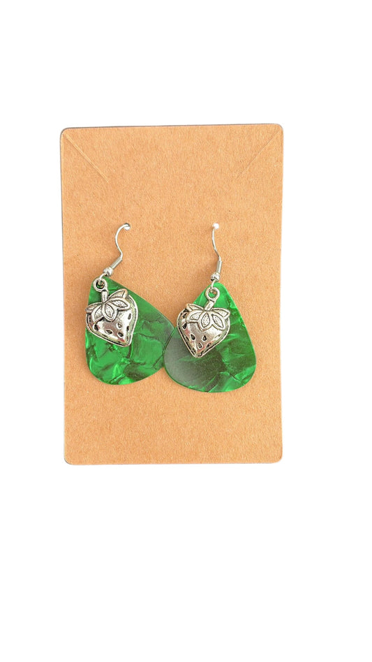 Guitar pics, green background, strawberry earrings