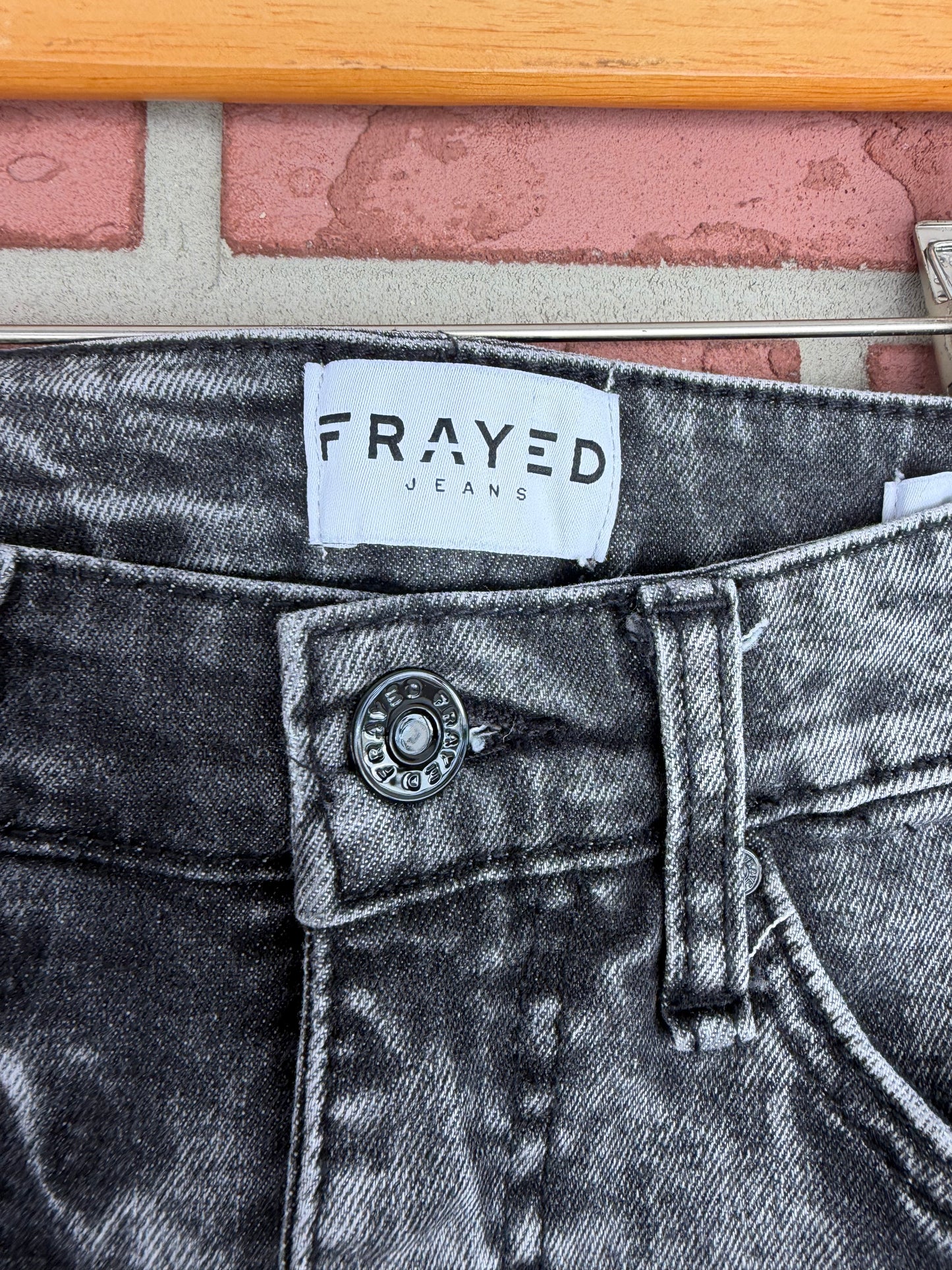 Frayed black denim jeans
